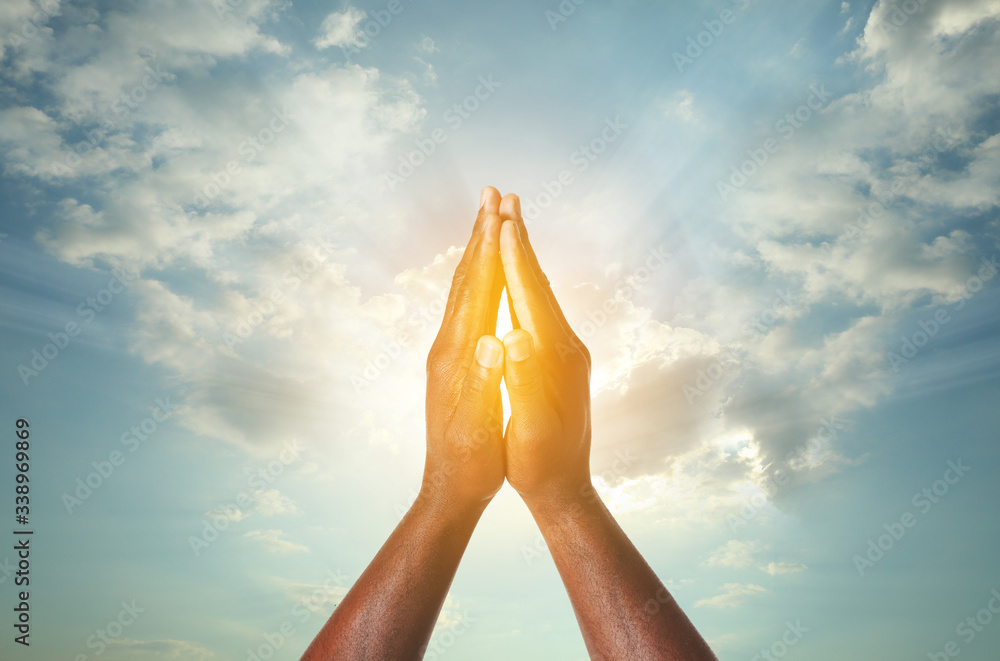 Hands of African-American man on white background